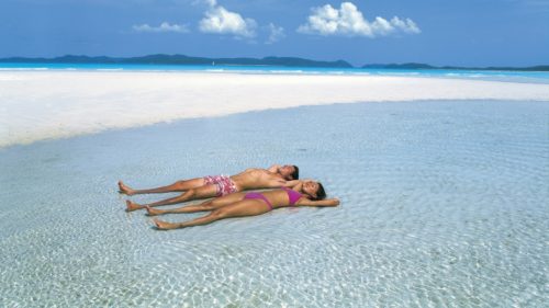 Sunbathing at whitehaven beach